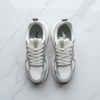 ACRUN white silver running shoes flat lay white marble