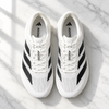 Adidas Adizero flat lay white marble lifestyle